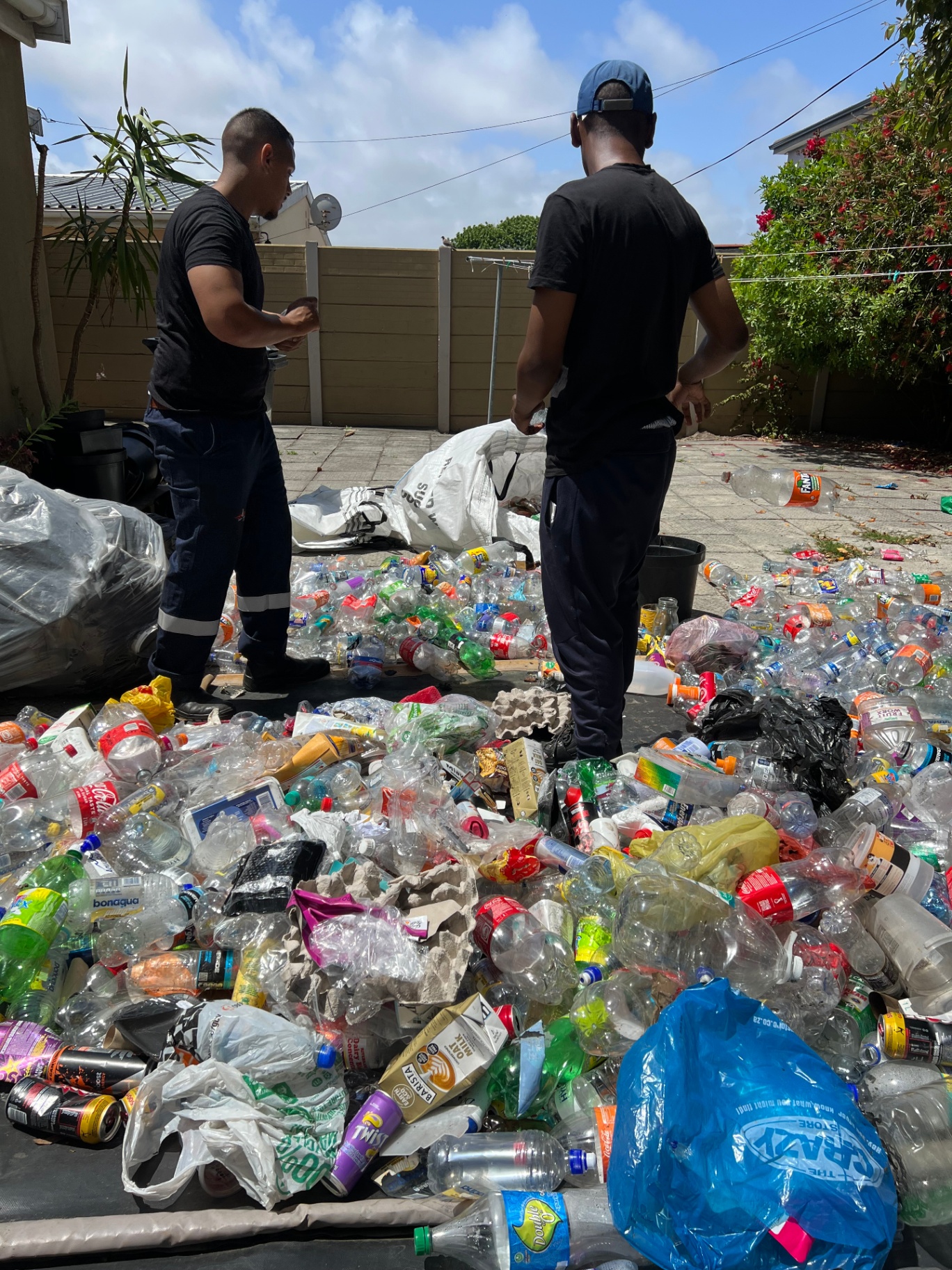 Whatever Junk Removals crew sorting recyclables in Cape Town